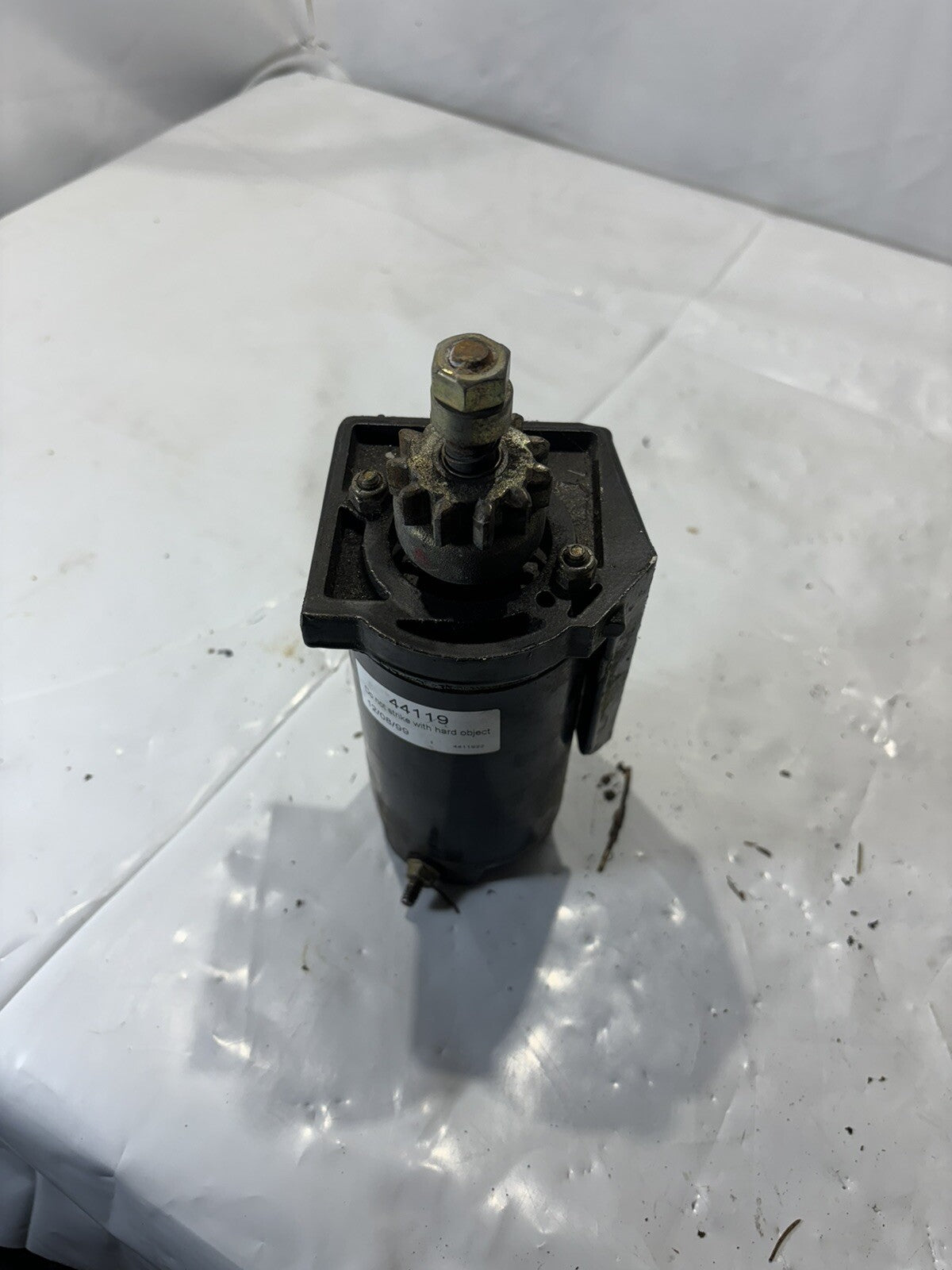 Starter and bracket from 50 HP Force outboard motor 1989